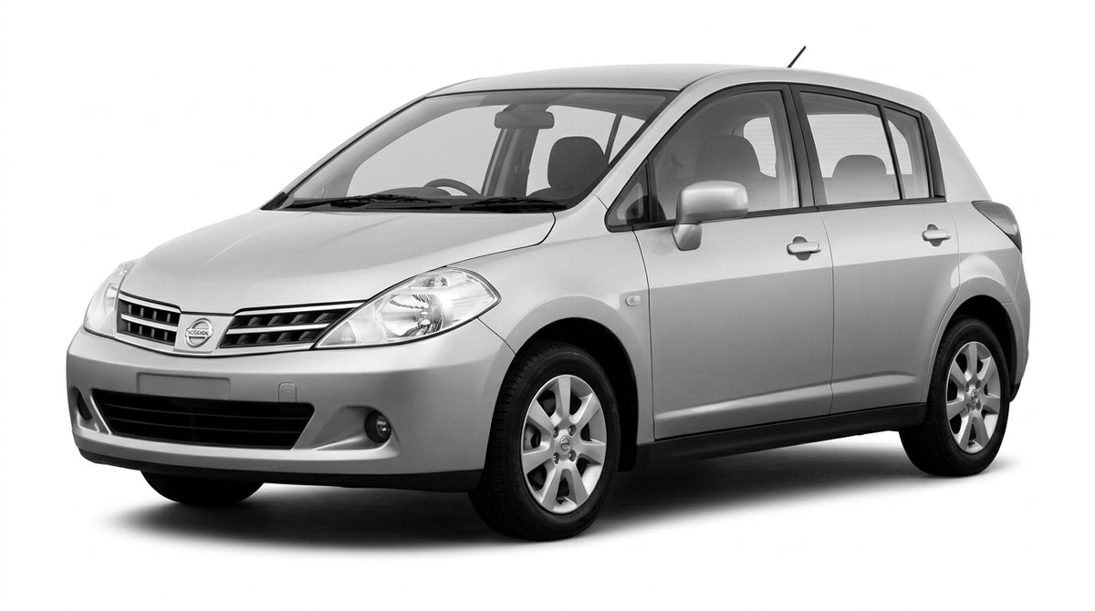 A silver Nissan Tidda hatchback car shown from a front angle